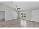 Open living area with tile floors and a front door to the home at 4126 Sw 132Nd Ln, Ocala, FL 34473