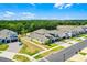 Aerial view of a neighborhood highlighting the house exteriors and landscaping at 4485 Renly Ln, Clermont, FL 34711