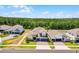 Aerial view of a neighborhood showing house exteriors and tree-lined streets at 4485 Renly Ln, Clermont, FL 34711