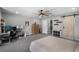 Bedroom with large windows, ceiling fan, and a desk for work or gaming at 4485 Renly Ln, Clermont, FL 34711