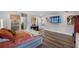 Spacious bedroom with a piano, TV, and modern décor at 4485 Renly Ln, Clermont, FL 34711