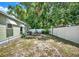 Spacious backyard featuring a fire pit, seating area, and privacy fence at 508 10Th St, St Cloud, FL 34769