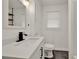The bathroom features new fixtures, stylish vanity, and sleek, modern design elements at 508 10Th St, St Cloud, FL 34769