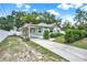 Well-maintained home with a covered parking area and a beautifully landscaped front yard at 508 10Th St, St Cloud, FL 34769