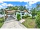 Charming home with a covered parking area, a well-manicured lawn, and inviting curb appeal at 508 10Th St, St Cloud, FL 34769