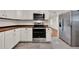 A beautifully updated kitchen with stainless appliances, butcher block countertops and subway tile backsplash at 508 10Th St, St Cloud, FL 34769