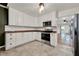 Well-lit kitchen with stainless steel appliances, subway tile backsplash and wood countertop at 508 10Th St, St Cloud, FL 34769