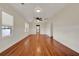 Sun-filled living room showcasing gleaming hardwood floors and traditional wall trim at 508 10Th St, St Cloud, FL 34769