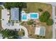 Aerial image featuring community amenities, including pools and a recreation area at 50989 Highway 27 # 371, Davenport, FL 33897