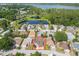 Aerial view of house surrounded by lush greenery and water at 50989 Highway 27 # 371, Davenport, FL 33897