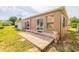 Backyard with patio, grass, and storage shed on a sunny day at 50989 Highway 27 # 371, Davenport, FL 33897