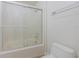 Bathroom with glass shower doors and neutral fixtures at 50989 Highway 27 # 371, Davenport, FL 33897