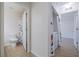 Hallway between the bathroom and laundry room with tile floor and white walls at 50989 Highway 27 # 371, Davenport, FL 33897