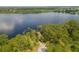 Scenic view of a lake surrounded by lush green trees, offering a serene and natural setting at 50989 Highway 27 # 371, Davenport, FL 33897