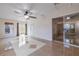Open-concept living room boasts tile flooring and a seamless transition to the outdoors via sliding glass doors at 50989 Highway 27 # 371, Davenport, FL 33897