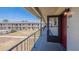 View from a condo balcony, overlooking the property's landscaped grounds and neighboring buildings at 5505 Hernandes Dr # 204, Orlando, FL 32808