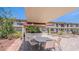 Community BBQ area with outdoor seating and a grilling station for residents at 5505 Hernandes Dr # 204, Orlando, FL 32808