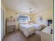 Cozy bedroom featuring two twin beds, neutral decor, a ceiling fan and a window at 5505 Hernandes Dr # 204, Orlando, FL 32808