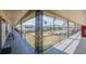 Exterior view from a covered walkway towards the community pool and common areas at 5505 Hernandes Dr # 204, Orlando, FL 32808