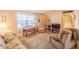 Bright living room with a large window, comfortable seating, and neutral decor at 5505 Hernandes Dr # 204, Orlando, FL 32808