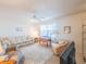 Comfortable living room with a floral sofa, matching lamps, and a neutral rug at 5505 Hernandes Dr # 204, Orlando, FL 32808