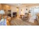 Living room with comfortable furniture and an open view to the kitchen, creating a welcoming space at 5505 Hernandes Dr # 204, Orlando, FL 32808