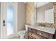 Bathroom features marble countertop, mosaic tile accent wall, and modern vanity at 618 Crownclover Ave, Orlando, FL 32828