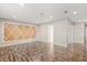 Spacious room with wood floors, wall decor, and access to closet at 618 Crownclover Ave, Orlando, FL 32828