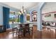 Bright breakfast nook with natural light and stylish dining set at 618 Crownclover Ave, Orlando, FL 32828