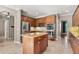Well-equipped kitchen with stainless steel appliances, center island and tiled floors at 618 Crownclover Ave, Orlando, FL 32828