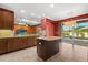 Modern kitchen with sleek countertops and sliding glass doors to outdoor pool area at 618 Crownclover Ave, Orlando, FL 32828