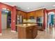 Well-equipped kitchen with stainless steel appliances, granite countertops, and island seating at 618 Crownclover Ave, Orlando, FL 32828