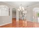 Spacious living room featuring hardwood floors, decorative ceiling, and open floor plan at 618 Crownclover Ave, Orlando, FL 32828