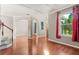 Open-concept living room features hardwood floors, archways, large window, and decorative ceiling at 618 Crownclover Ave, Orlando, FL 32828