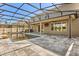 Beautiful backyard pool with screened enclosure, patio, and elegant paving at 618 Crownclover Ave, Orlando, FL 32828