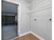 Bright laundry room featuring wire shelving, with garage access at 751 Via Milano, Apopka, FL 32712
