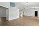 Bright living room with recessed lighting, wood floors, and a view into the kitchen and other areas of the home at 751 Via Milano, Apopka, FL 32712
