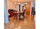 Inviting dining area with hardwood floors, a chandelier, and a round table, creating an ideal space for meals at 76 Oakdale St, Windermere, FL 34786