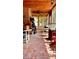 Enclosed sunroom featuring brick flooring and ceiling, filled with natural light, and a peaceful atmosphere at 76 Oakdale St, Windermere, FL 34786