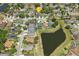 Residential aerial view of neighborhood, showing proximity to local pond, community and other neighborhood amenities at 9915 Kona Isle Ct, Orlando, FL 32817