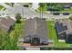 An aerial view of the home showing the brick patio and fencing with the surrounding community at 9915 Kona Isle Ct, Orlando, FL 32817