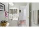 Cozy bathroom with tile floors, mirror, and doorway at 9915 Kona Isle Ct, Orlando, FL 32817