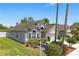 Beautiful home featuring manicured landscaping and an architectural design with a side entry garage at 9915 Kona Isle Ct, Orlando, FL 32817