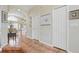 Hallway with tile floors leading to arched doorway at 9915 Kona Isle Ct, Orlando, FL 32817