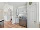 Kitchen with stainless steel refrigerator and tile floors at 9915 Kona Isle Ct, Orlando, FL 32817