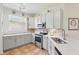 Bright kitchen with stainless steel appliances, tile floors and light counter tops at 9915 Kona Isle Ct, Orlando, FL 32817