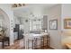 Open concept kitchen with white counter tops, island and bar seating at 9915 Kona Isle Ct, Orlando, FL 32817