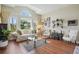 Bright living room with large windows, high ceilings, and elegant decor at 9915 Kona Isle Ct, Orlando, FL 32817