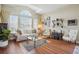 Bright living room with large windows, high ceilings, and elegant decor at 9915 Kona Isle Ct, Orlando, FL 32817