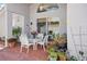 Outdoor patio with brick pavers, seating, plants, and ceiling fan at 9915 Kona Isle Ct, Orlando, FL 32817